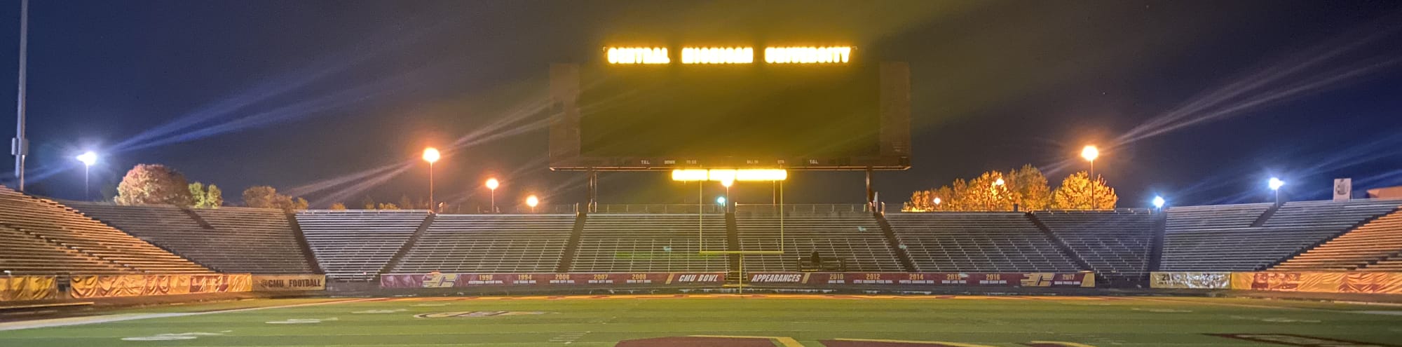 empty football stadium at night under the lights Charleston