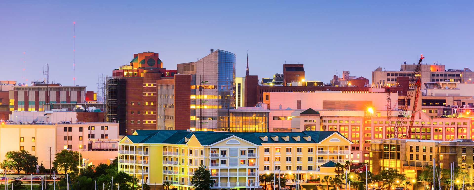 Neon color image of a band playing and people singing along